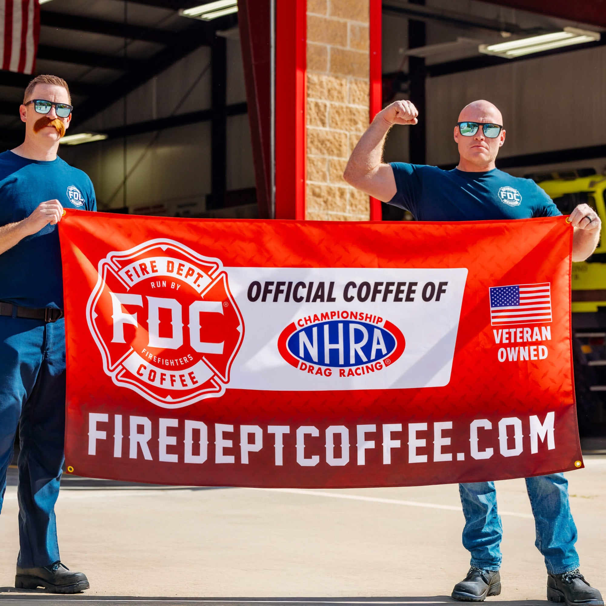 A red banner featuring Fire Department Coffee as the Official Coffee of the NHRA.