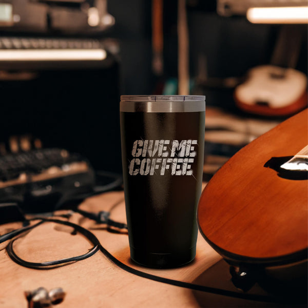 A 20 ounce black tumbler that says GIVE ME COFFEE on the front