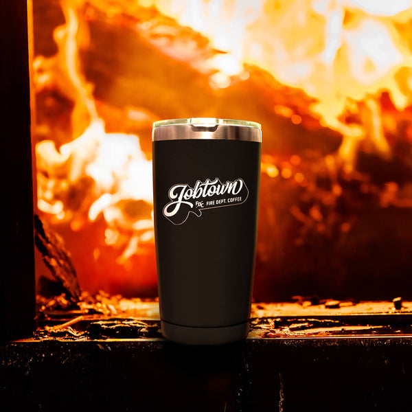 A 20 ounce black tumbler that says JOBTOWN on the front.