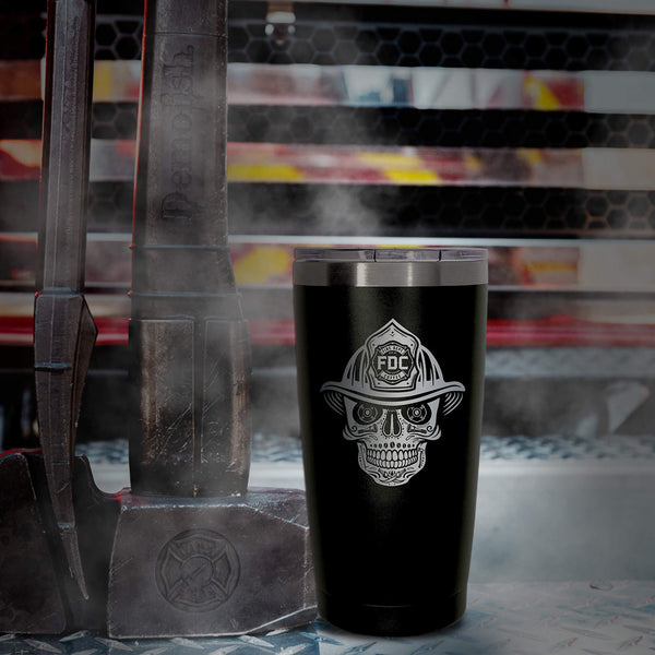 Front view of black tumbler with engraved FDC skull logo