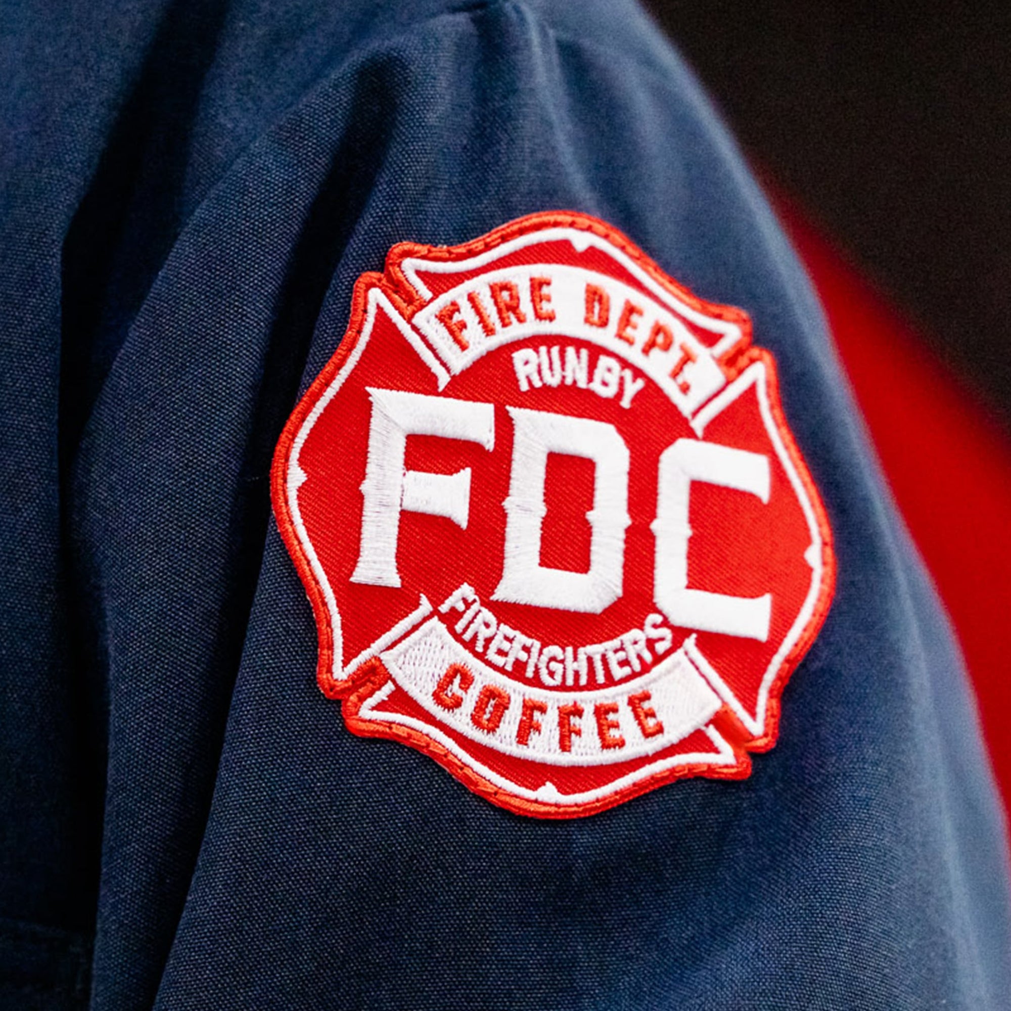 A red Fire Department Coffee patch