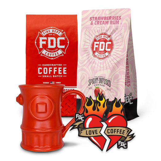 The Coffee Lover Valentine’s Bundle, containing a bag of Original Medium Roast, Strawberries and Cream Rum Infused Coffee, a set of Love Coffee Stickers, and a Fire Hydrant mug.