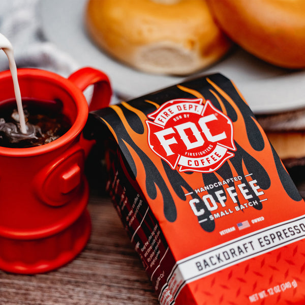 Fire Dept. Coffee's 12 ounce Backdraft Espresso package. A rectangular package with Fire Dept. Coffee's logo centered on a black field with fiery highlights.