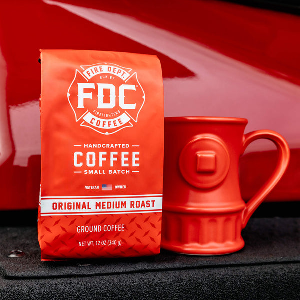 A 12 ounce bag of Original Medium Roast Coffee and a red Fire Hydrant Coffee Mug