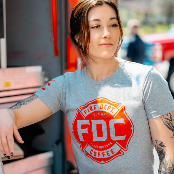 A gray t-shirt with the red Fire Department Coffee maltese cross logo on the front