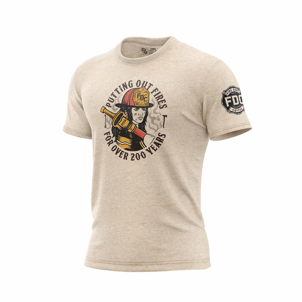 Image of a cream colored shirt with a graphic of a female firefighter on the front of the shirt and text that reads, "Putting out fires for over 200 years"